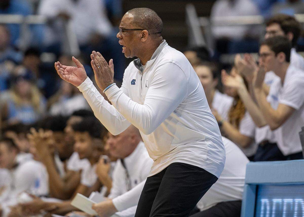 North Carolina coach Hubert Davis applauds his team on defense in the first half against Clemson on Saturday, February 11, 2023 at the Smith Center in Chapel Hill, N.C.