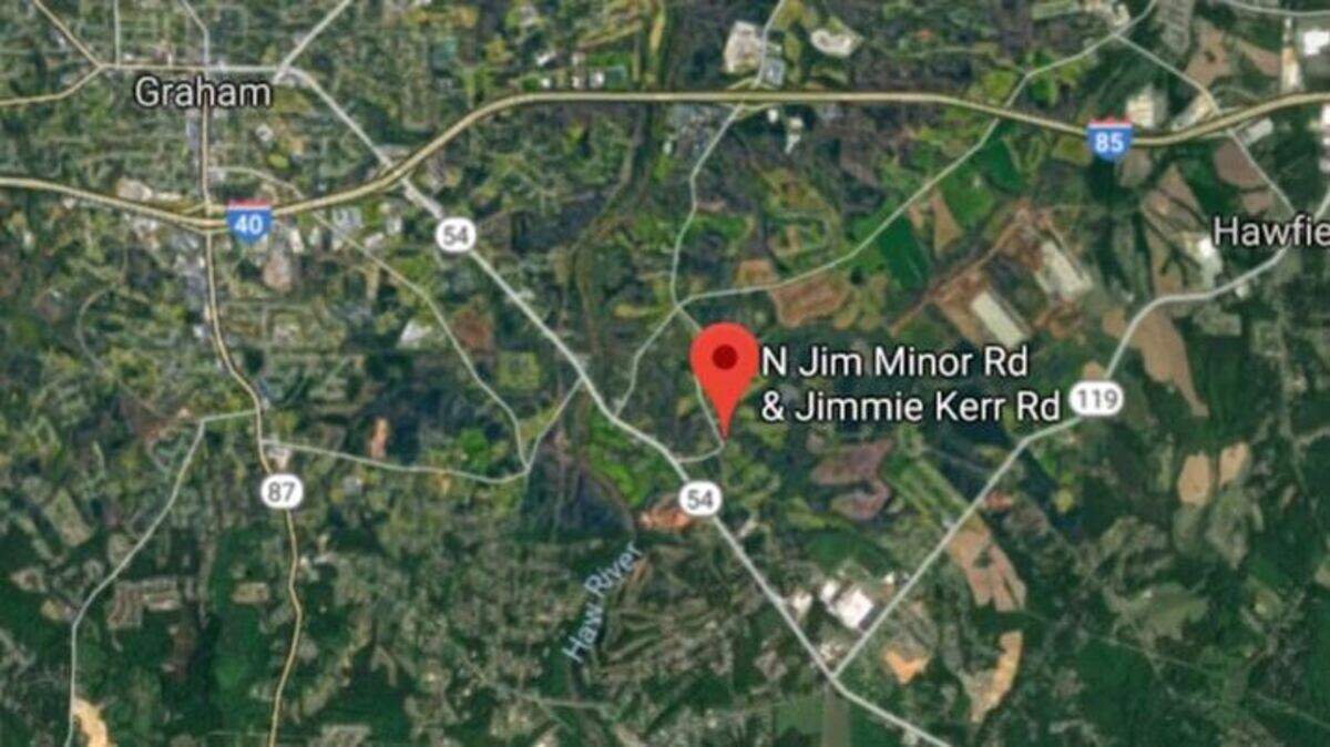 An Alamance-Burlington School System bus carrying high school students slid down an embankment on its side Friday, Nov. 16, 2018, after a wheel went off pavement and onto a shoulder softened by heavy recent rains and the driver overcorrected, the North Carolina State Highway Patrol said.