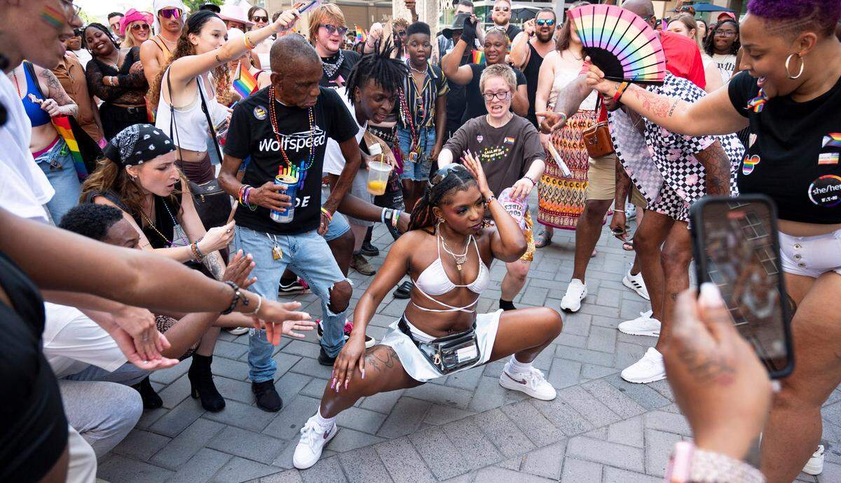 Deja dances in the middle of the dance circle at Raleigh Pride on Saturday, June 22, 2024. Deja who goes by “Big Dumpy” when she dances was excited to attend her first pride event.