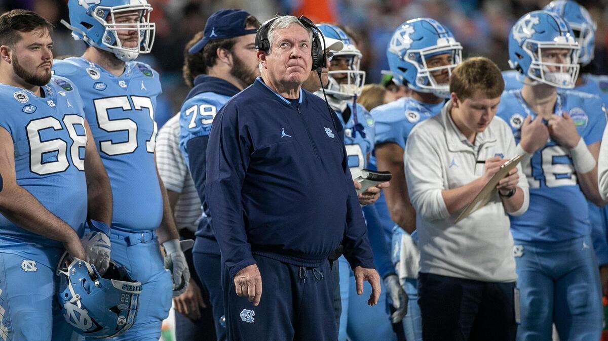North Carolina coach Mack Brown glances at the scoreboard after Clemson’s Will Shipley scored to give the Tigers’ a 39-10 lead in the third quarter in the ACC Championship game on Saturday, December 3, 2022 at Bank of American Stadium in Charlotte, N.C.