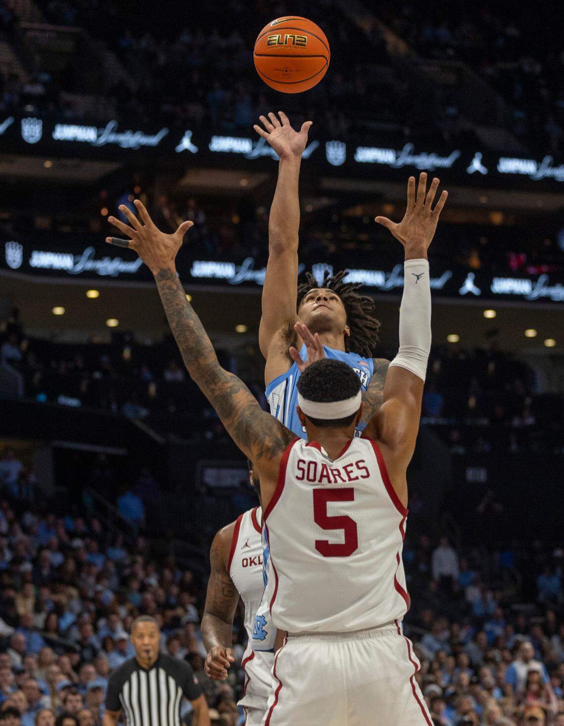 North Carolina’s Elliot Cadeau (2) puts up a shot over Oklahoma’s Rivaldo Soares (5) in the first half on Wednesday, December 20, 2023 at the Spectrum Center in Charlotte, N.C.
