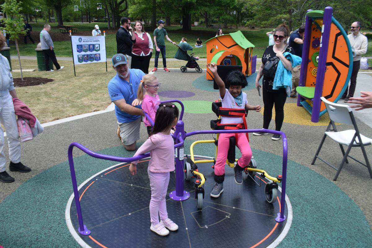 Children play at the Chapel Hill Community Center Park, which has accessible features for children.