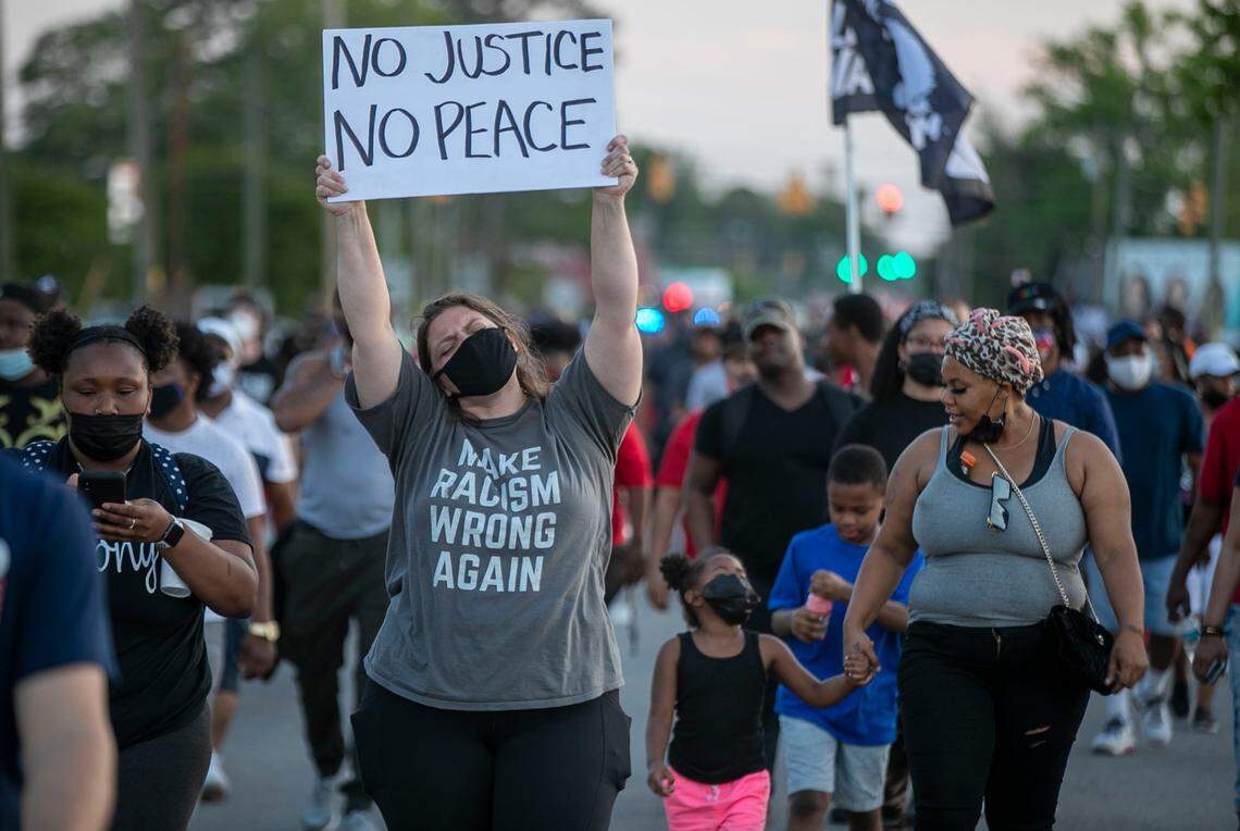 Demonstrators march along Hughes Blvd. on Wednesday, April 28, 2021 in Elizabeth City, N.C. This is the eighth day of demonstrations in the wake of Andrew Brown Jr.s death at the hands of Pasquotank County deputies.