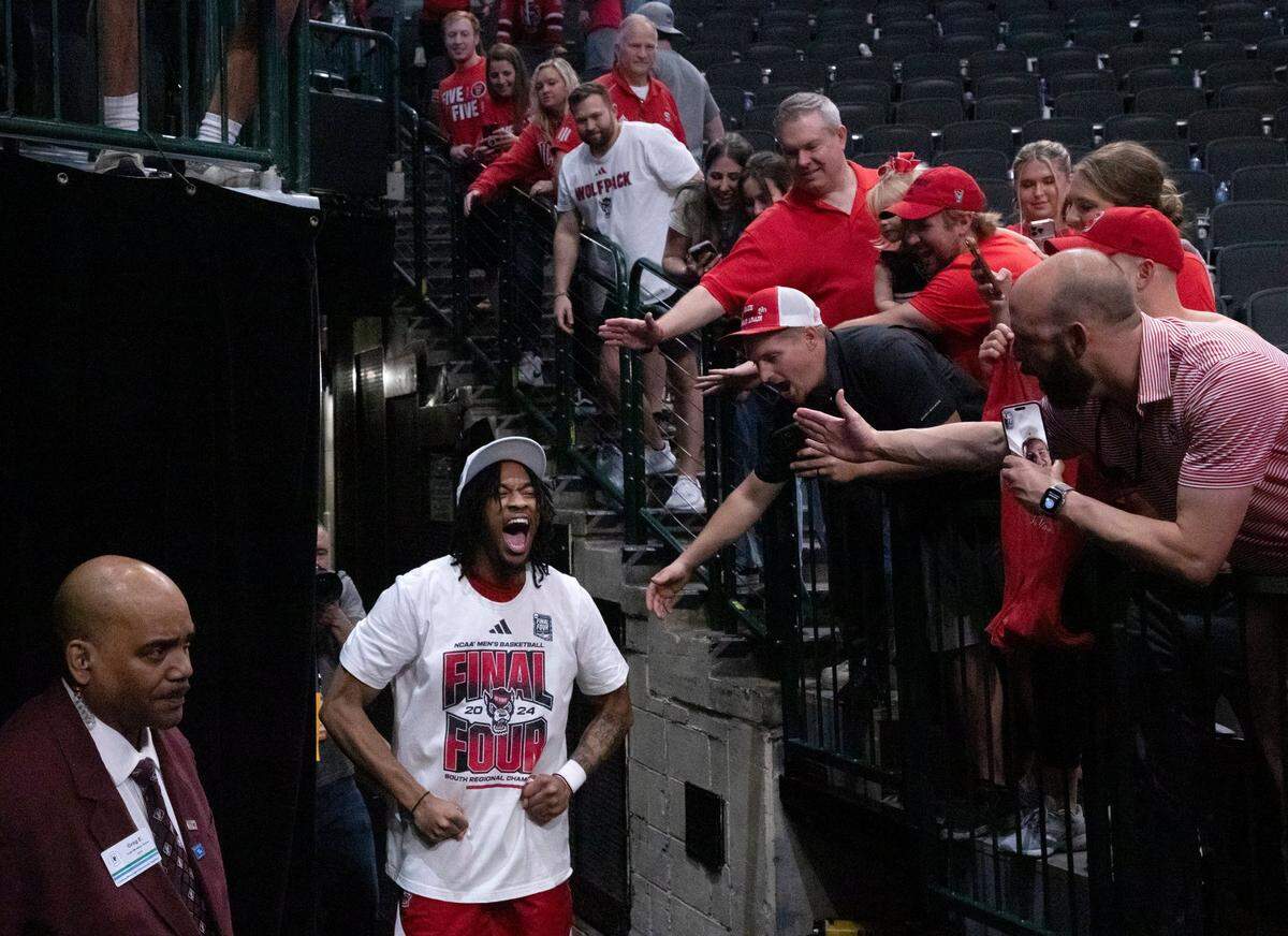 N.C. State’s Jayden Taylor celebrates as he leaves the court following the Wolfpack’s 76-64 win over Duke in the NCAA Tournament Elite Eight on Sunday, March 31, 2024, at American Airlines Center in Dallas, Texas.