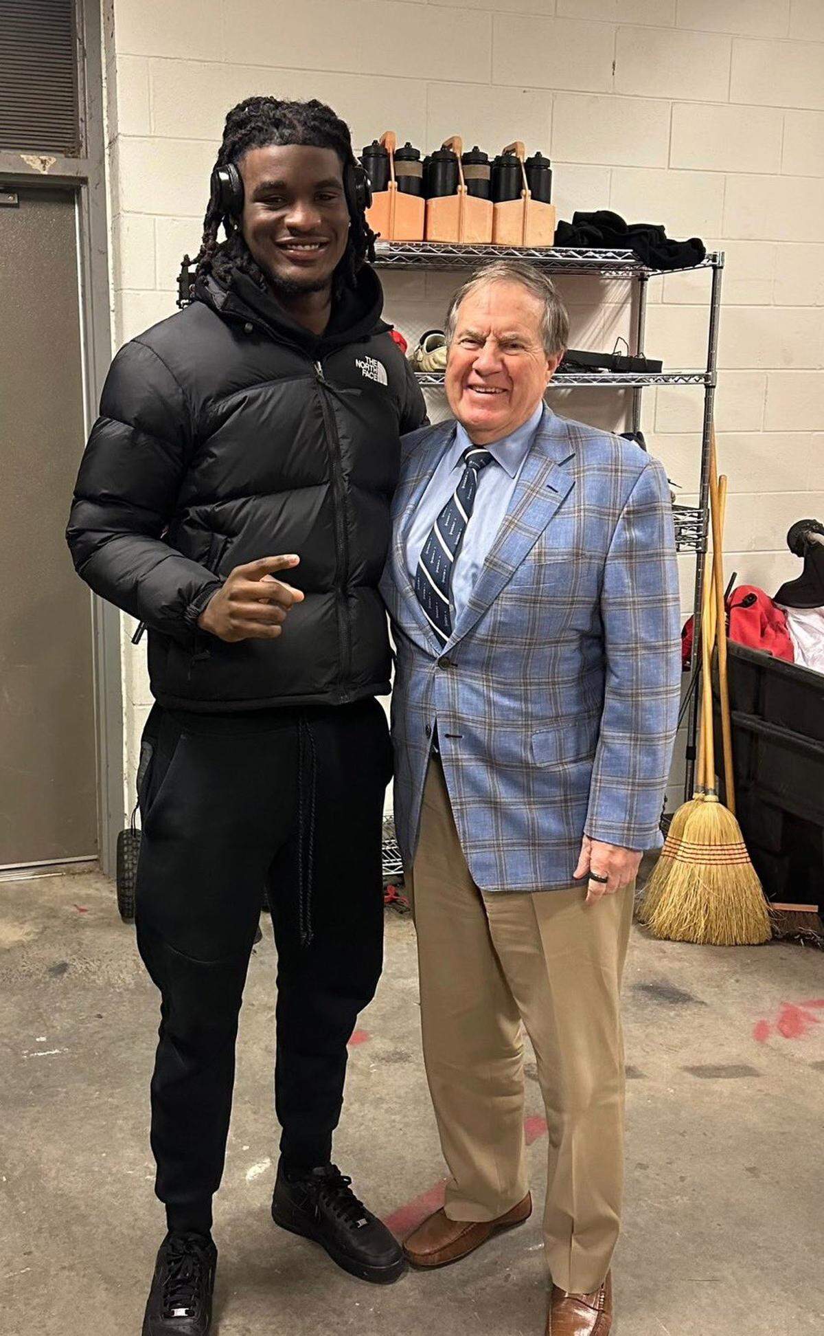 In this photo posted to his X social media account, Zavion Griffin-Haynes, left, poses with UNC head football coach Bill Belichick during a recruiting visit in January.