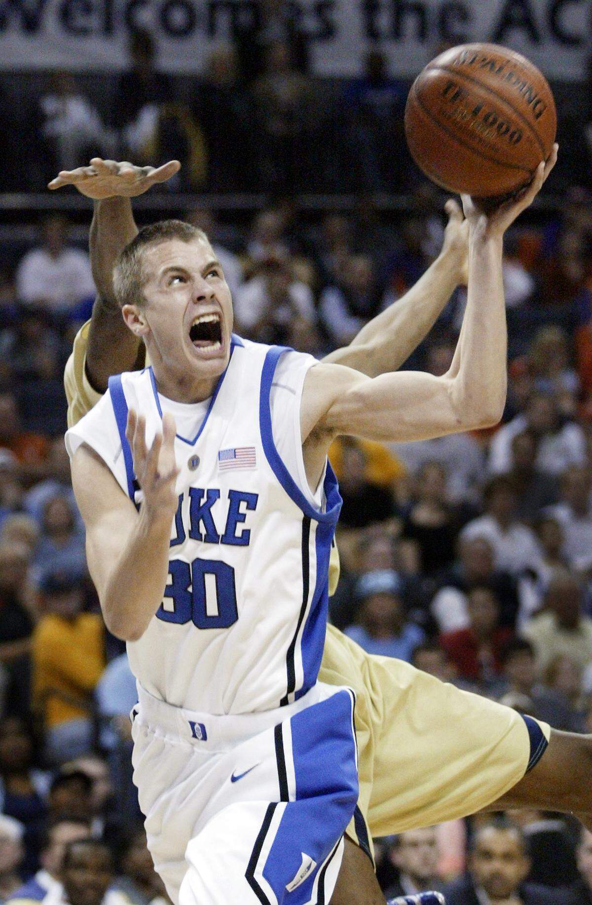Duke's Jon Scheyer (30) shoots in front of Georgia Tech's Alade Aminu (44) in the quarterfinals of the ACC Men's Basketball Tournament, at Charlotte Bobcats Arena, on Friday, March 14, 2008.