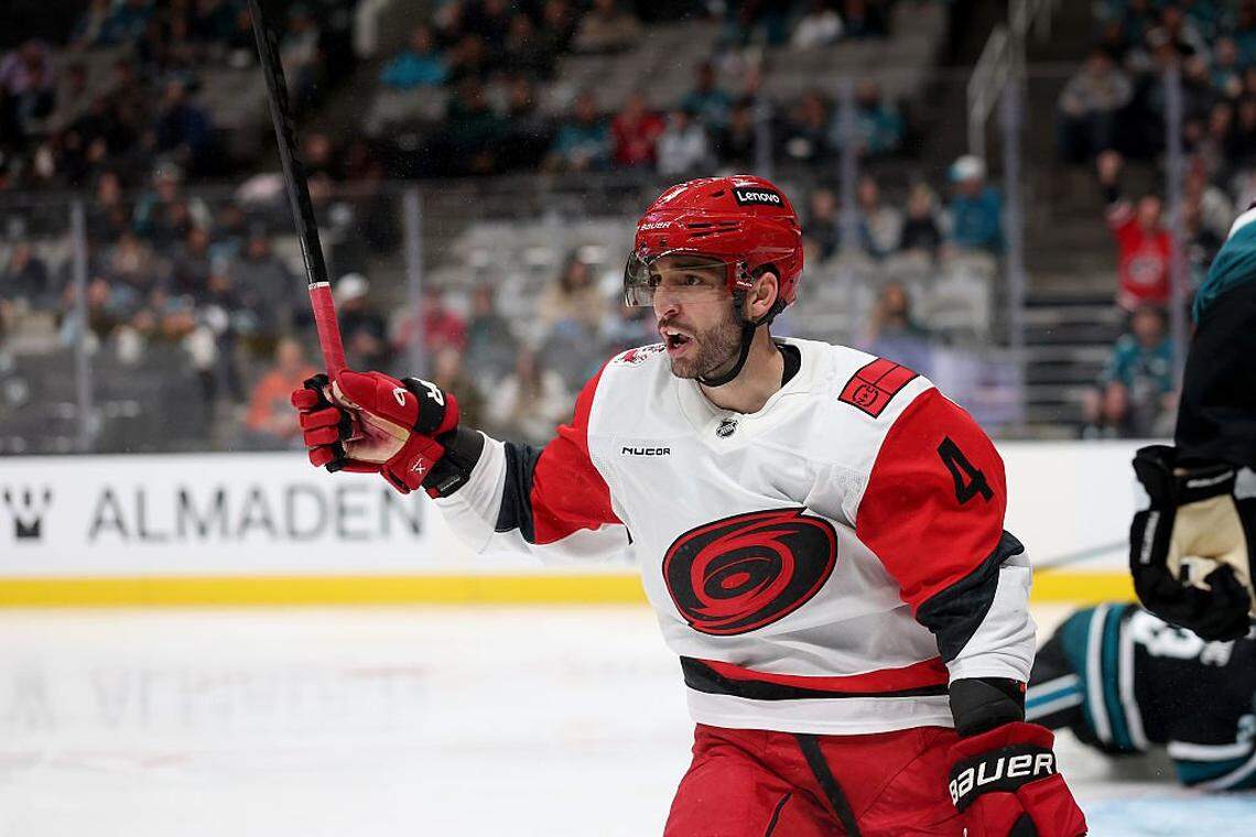 Shayne Gostisbehere of the Carolina Hurricanes reacts after he scored a goal against the San Jose Sharks during the third period at SAP Center on October 14, 2025 in San Jose, California.