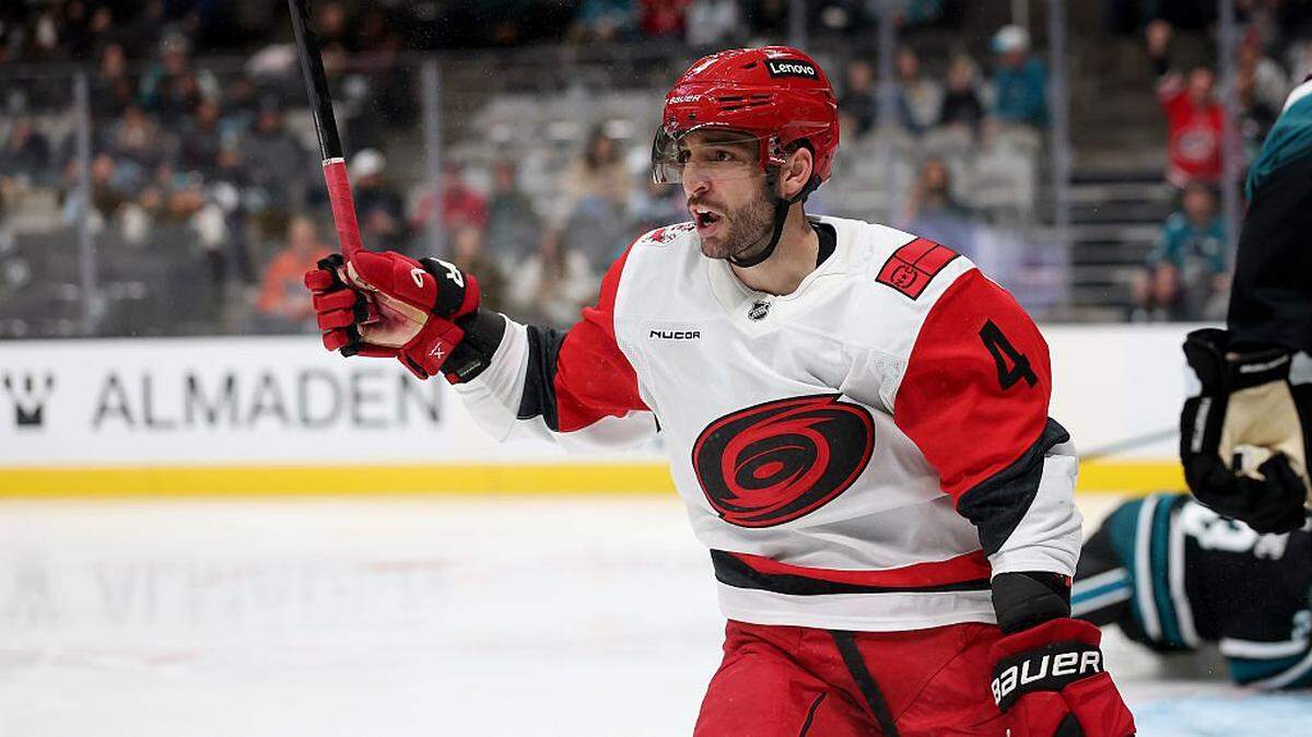 Shayne Gostisbehere of the Carolina Hurricanes reacts after he scored a goal against the San Jose Sharks during the third period at SAP Center on October 14, 2025 in San Jose, California.