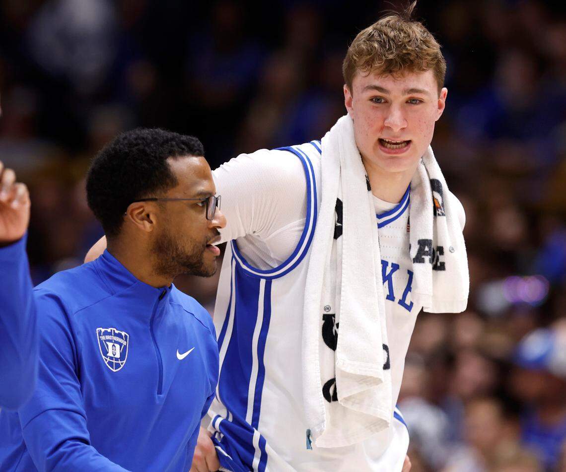 Duke associate head coach Jai Lucas talks with Cooper Flagg as they head to the locker room at halftime during Duke’s game against Florida State at Cameron Indoor Stadium in Durham, N.C., Saturday, March 1, 2025.