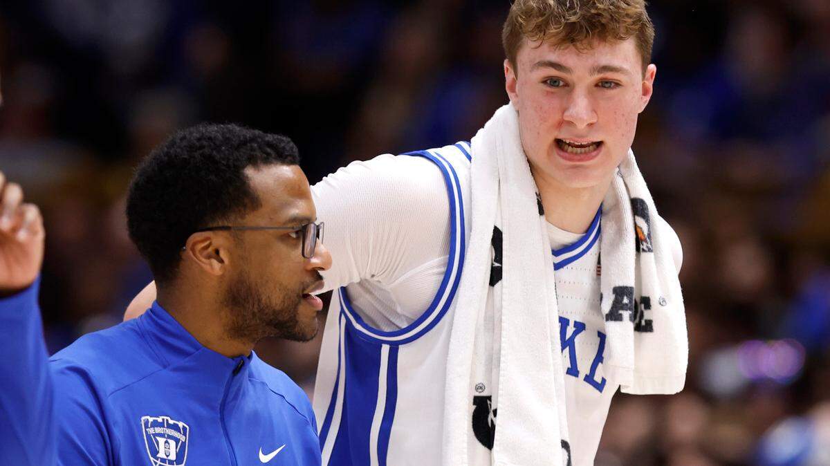 Duke associate head coach Jai Lucas talks with Cooper Flagg as they head to the locker room at halftime during Duke’s game against Florida State at Cameron Indoor Stadium in Durham, N.C., Saturday, March 1, 2025.