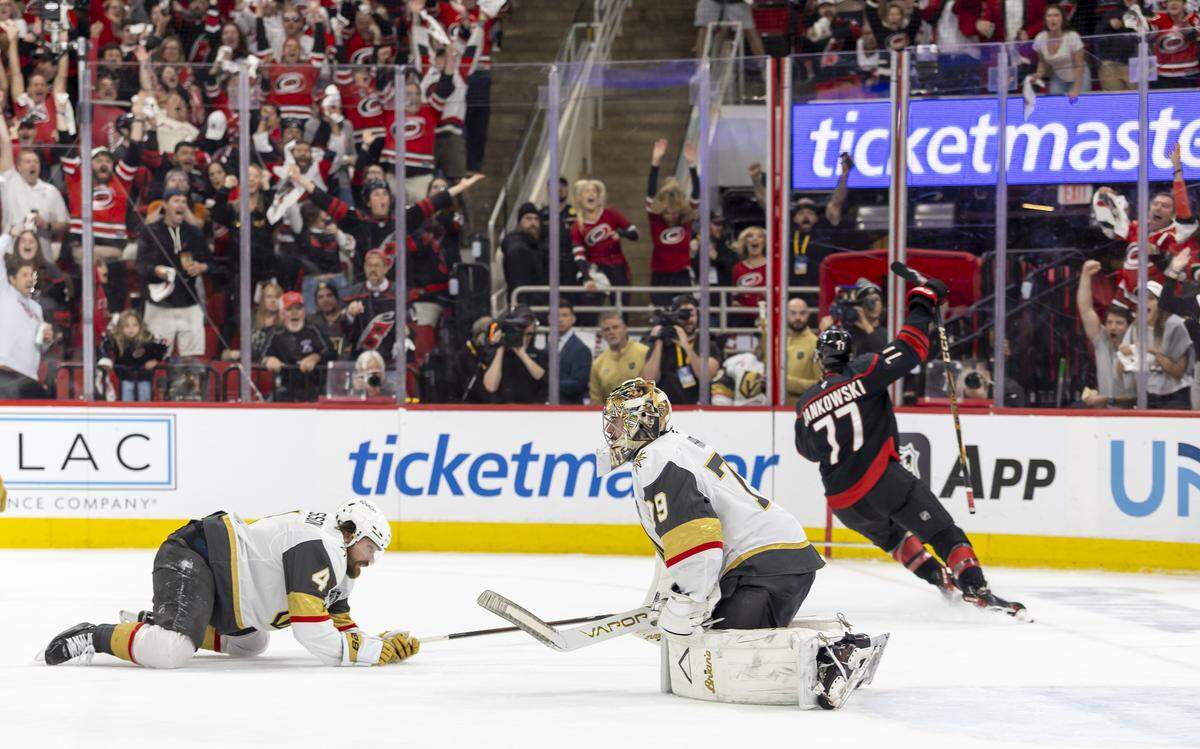 Vegas defenseman Rasmus Andersson (4) and goalie Carter Hart (79) react after a goal by Carolina Hurricanes left wing Mark Jankowski (77) to tie the score 2-2 in Game 2 of the Stanley Cup Final, on Thursday, June 4, 2026 at Lenovo Center in Raleigh, N.C. 