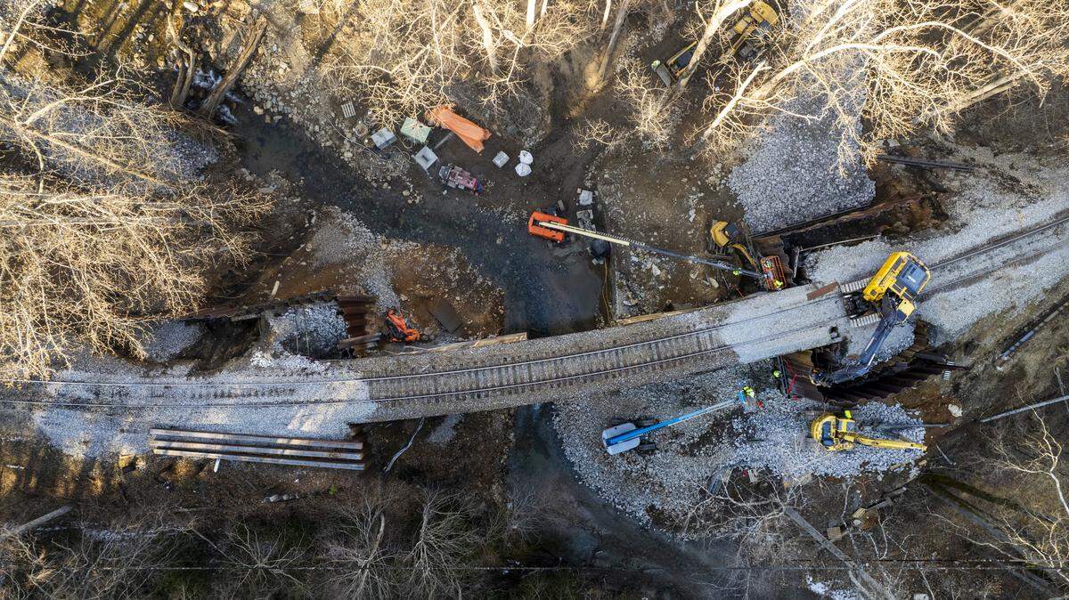Crews work to repair a railroad bridge on a section of Norfolk Southern’s AS Line near Old Fort, east of Asheville, on Monday, Feb. 9, 2026.