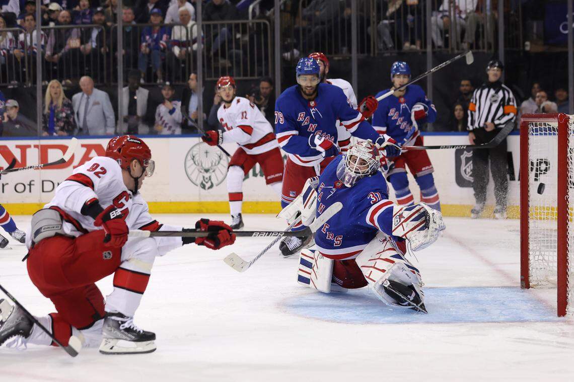 May 13, 2024; New York, New York, USA; Carolina Hurricanes center Evgeny Kuznetsov (92) scores a goal against New York Rangers goaltender Igor Shesterkin (31) during the third period of game five of the second round of the 2024 Stanley Cup Playoffs at Madison Square Garden. Mandatory Credit: Brad Penner-USA TODAY Sports