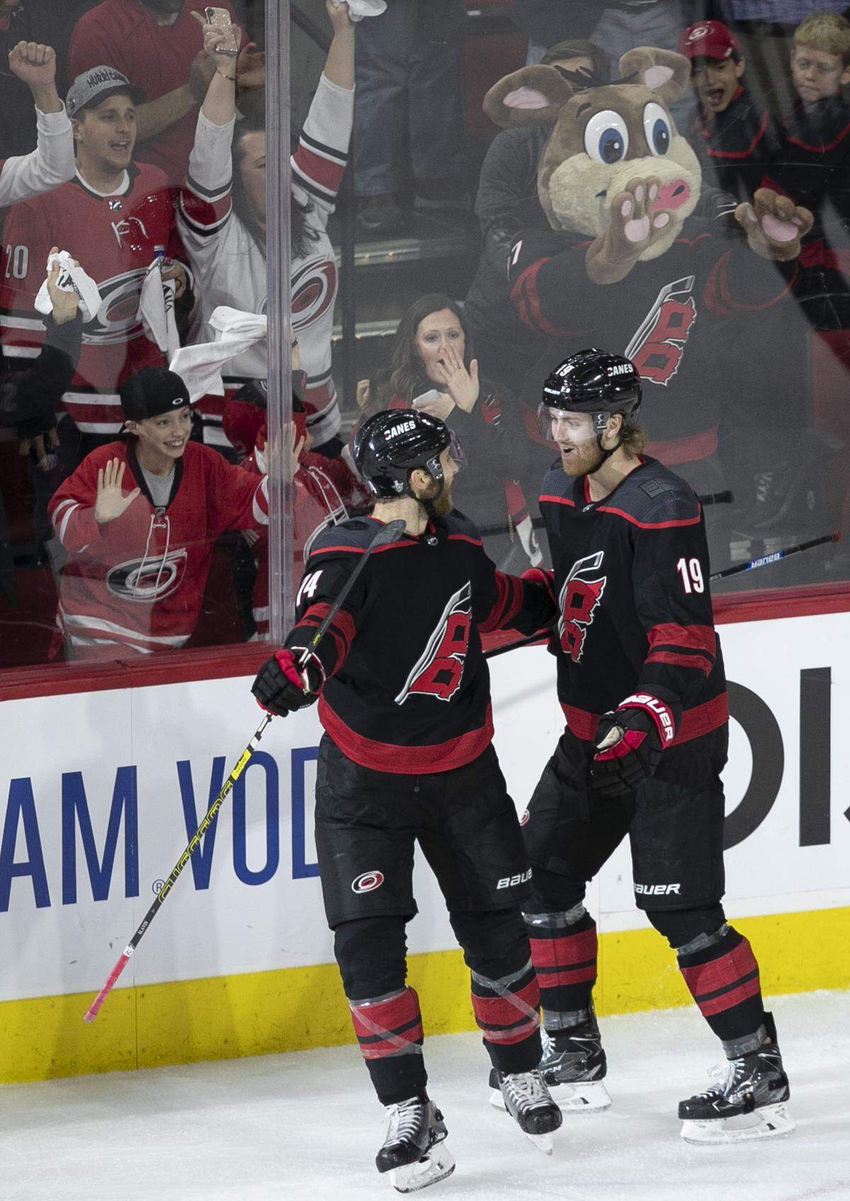Carolina Hurricanes’ Dougie Hamilton (19) celebrates after scoring a goal in the second period with teammate Jaccob Slavin (74) during their first round Stanley Cup game on Monday, April 15, 2019 at the PNC Arena on Raleigh, N.C.
