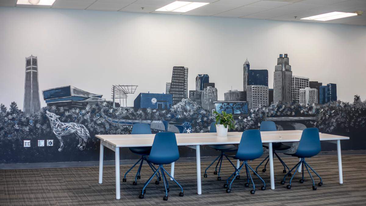 A mural of Raleigh landmarks inside HQ Raleigh’s new Centennial Campus space.