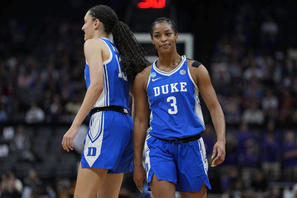 Jordan Wood, left, and Ashlon Jackson of the Duke Blue Devils react against the Louisiana State Tigers during the fourth quarter of their 2026 NCAA Women's Basketball Tournament Sweet 16 game at Golden 1 Center on March 27, 2026 in Sacramento, California.