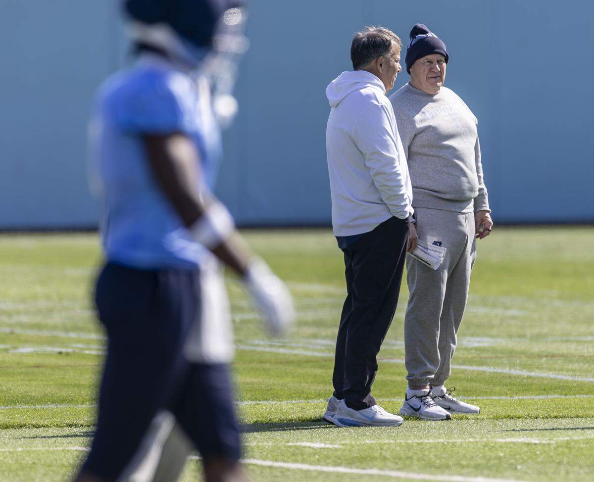 North Carolina coach Bill Belichick talks with general manager Michael Lombardi, during the Tar Heels’ spring practice, on Tuesday, March 24, 2026, at Kenan Stadium Chapel Hill, N.C.
