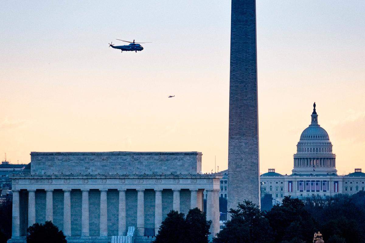 Marine One carrying President Donald Trump flies past the Lincoln Memorial, Washington Monument and the U.S. Capitol as he departs the White House for the final time as President, Wednesday, Jan. 20, 2021.