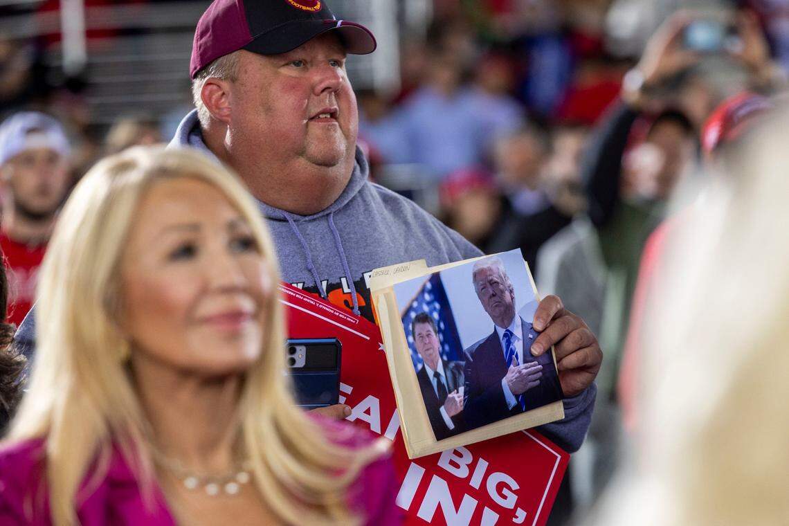Supporters listen as Republican presidential nominee and former President Donald Trump speaks during a rally at Dorton Arena in Raleigh on Monday, Nov. 4, 2024, one day before Election Day.