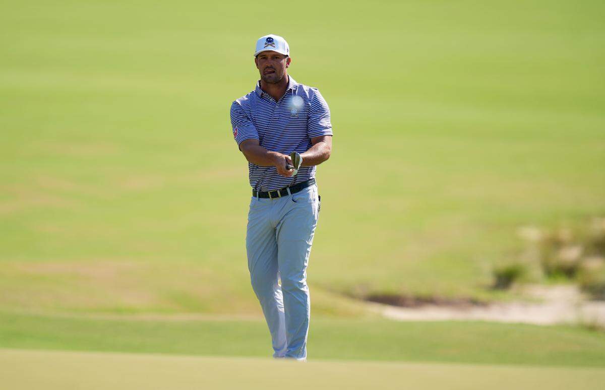 Jun 14, 2024; Pinehurst, North Carolina, USA; Bryson DeChambeau chips on the 5th hole during the second round of the U.S. Open golf tournament at Pinehurst No. 2. Mandatory Credit: Jim Dedmon-USA TODAY Sports