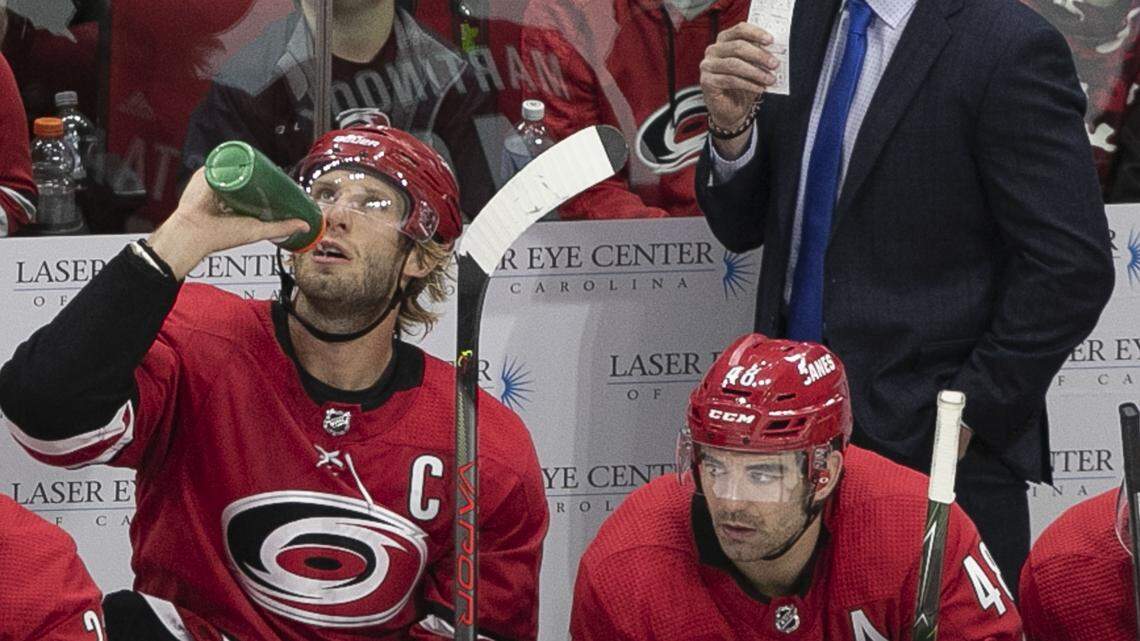 Carolina Hurricanes’ captain Jordan Staal (11) takes a breather on the bench as coach Rod Brind’Amour keeps an eye on the action during the third period against Montreal on Thursday, October 3, 2019 at the PNC Arena in Raleigh, N.C.