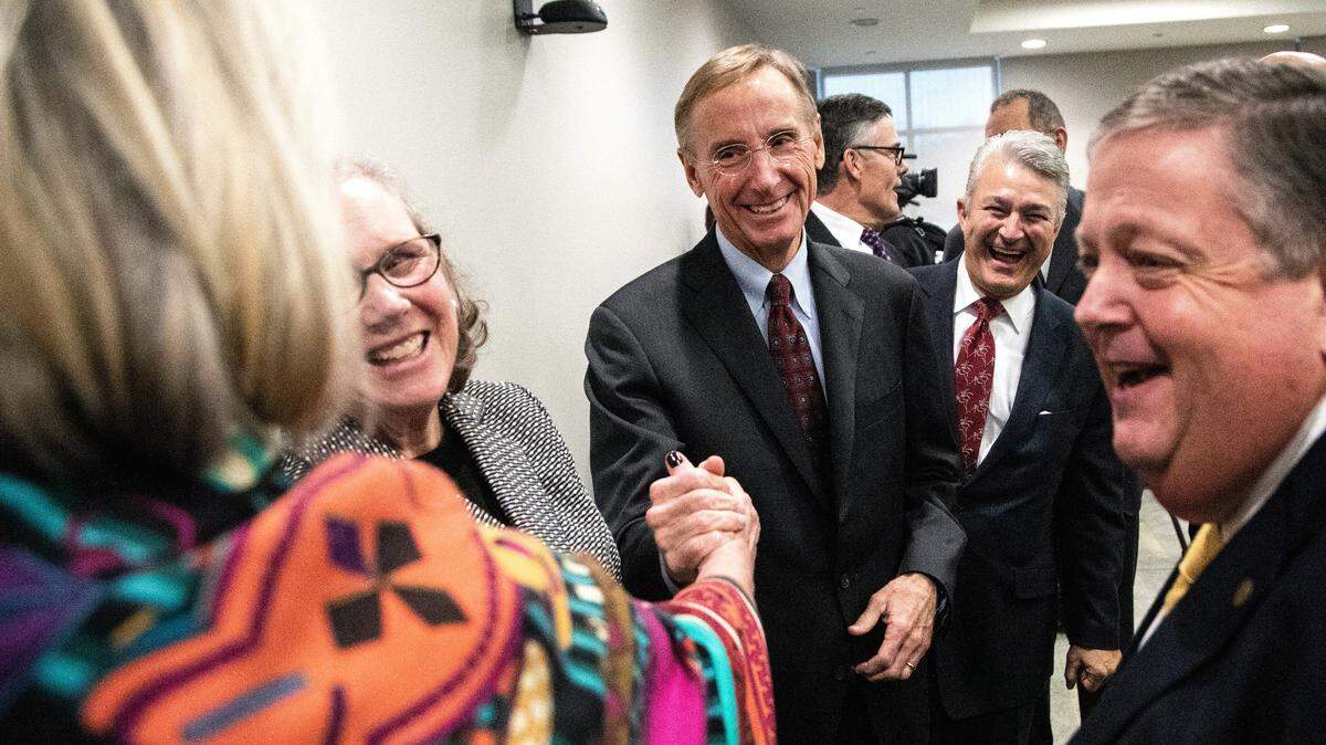 Wesley Burks receives congratulations after he was named CEO of UNC Health and Dean of the UNC School of Medicine on Dec. 14, 2018.