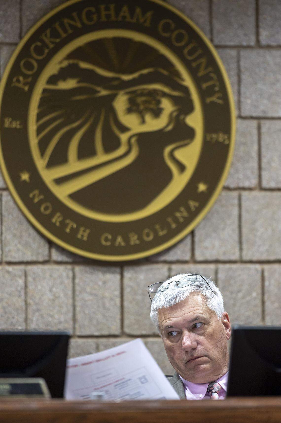 Don Powell, chairman of the Rockingham County Board of Elections, inspects provisional ballots in the race between North Carolina Senate President Pro Tempore Phil Berger and his challenger, Rockingham County Sheriff Sam Page, on Friday, March 6, 2026 in Reidsville, N.C.