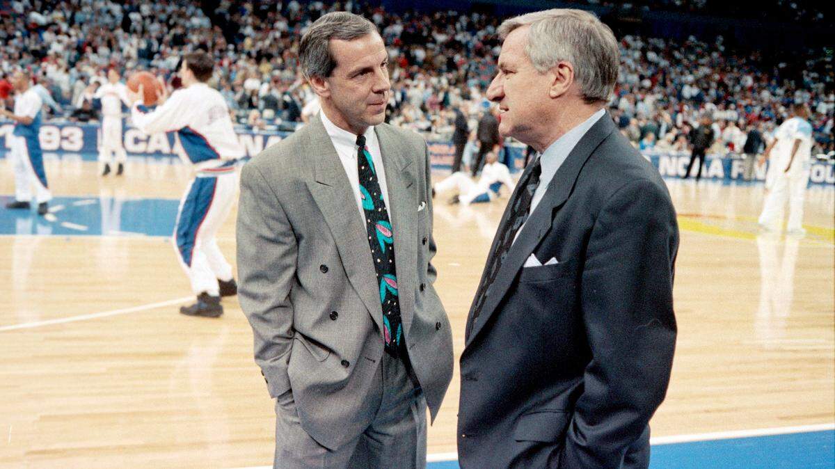 Kansas coach Roy Williams (left) talks with his mentor UNC coach Dean Smith before their two teams met in the 1993 National Championship semfinal game in New Orleans. UNC came out on top and went on to defeat Michigan to win the National Championship.
