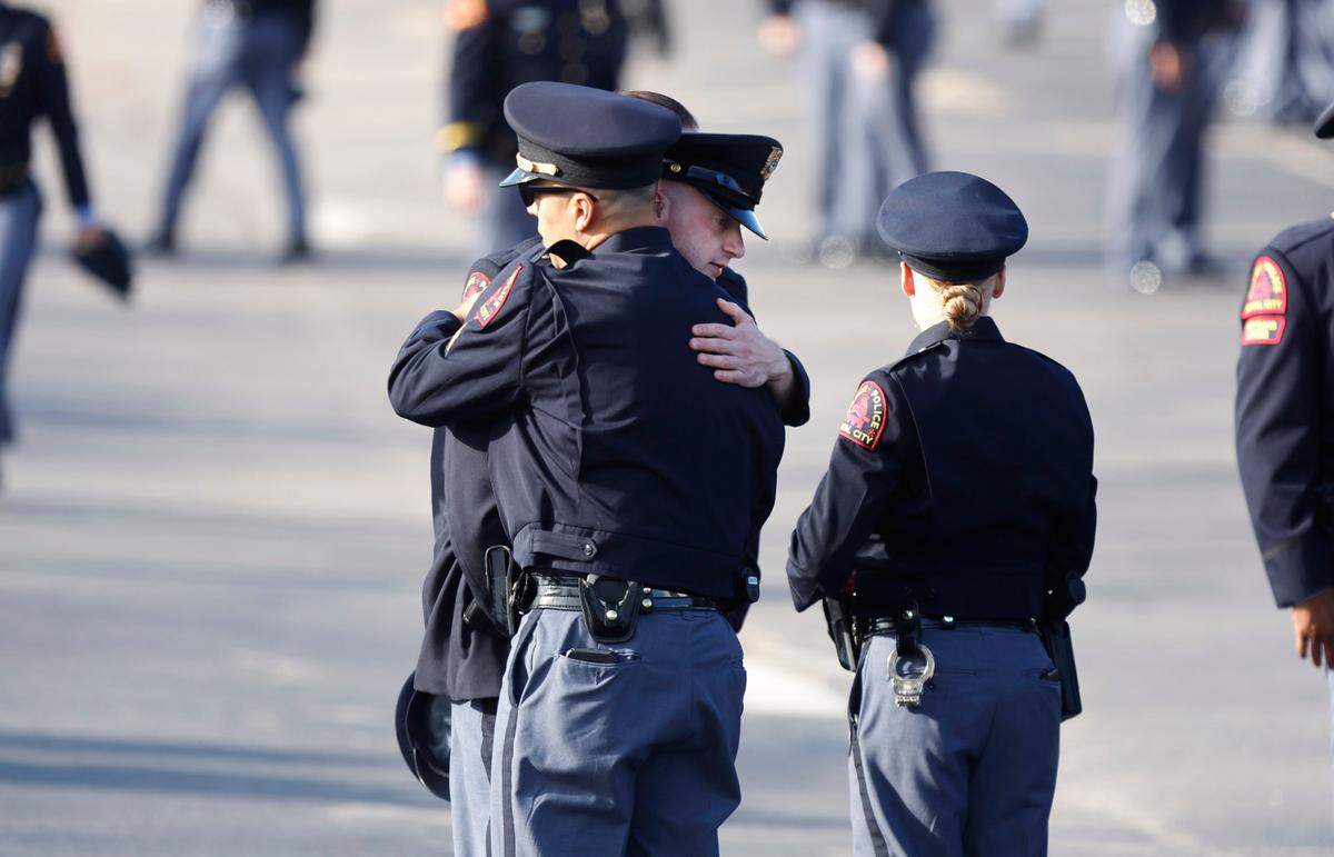 Police officers gather outside Cross Assembly Church in Raleigh, N.C., before the funeral of Raleigh Police Officer Gabriel Torres Saturday, Oct. 22, 2022.