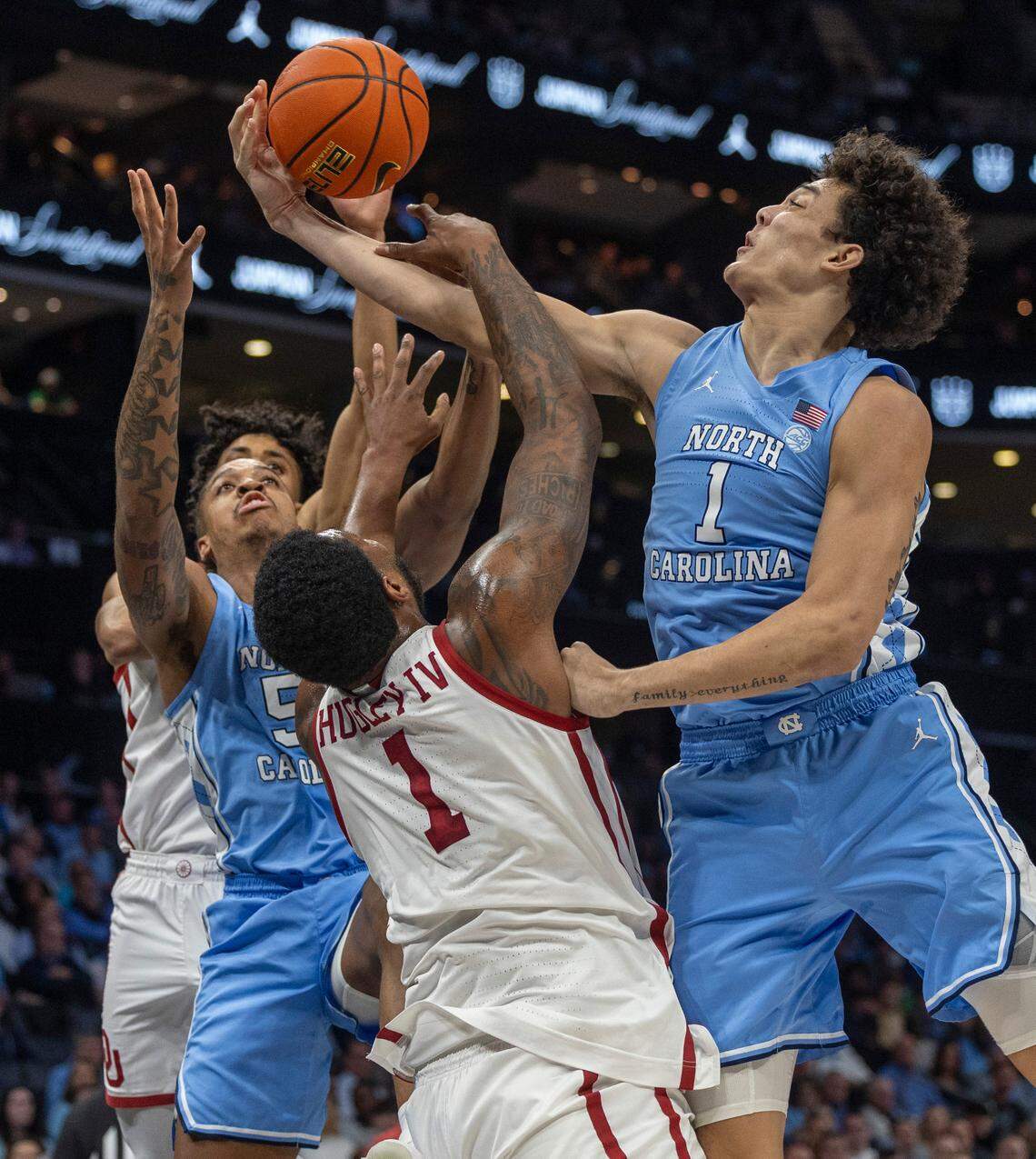 North Carolina’s Zayden High (1) controls an offensive rebound over Oklahoma’s Otega Oweh (3) in the first half on Wednesday, December 20, 2023 at the Spectrum Center in Charlotte, N.C.