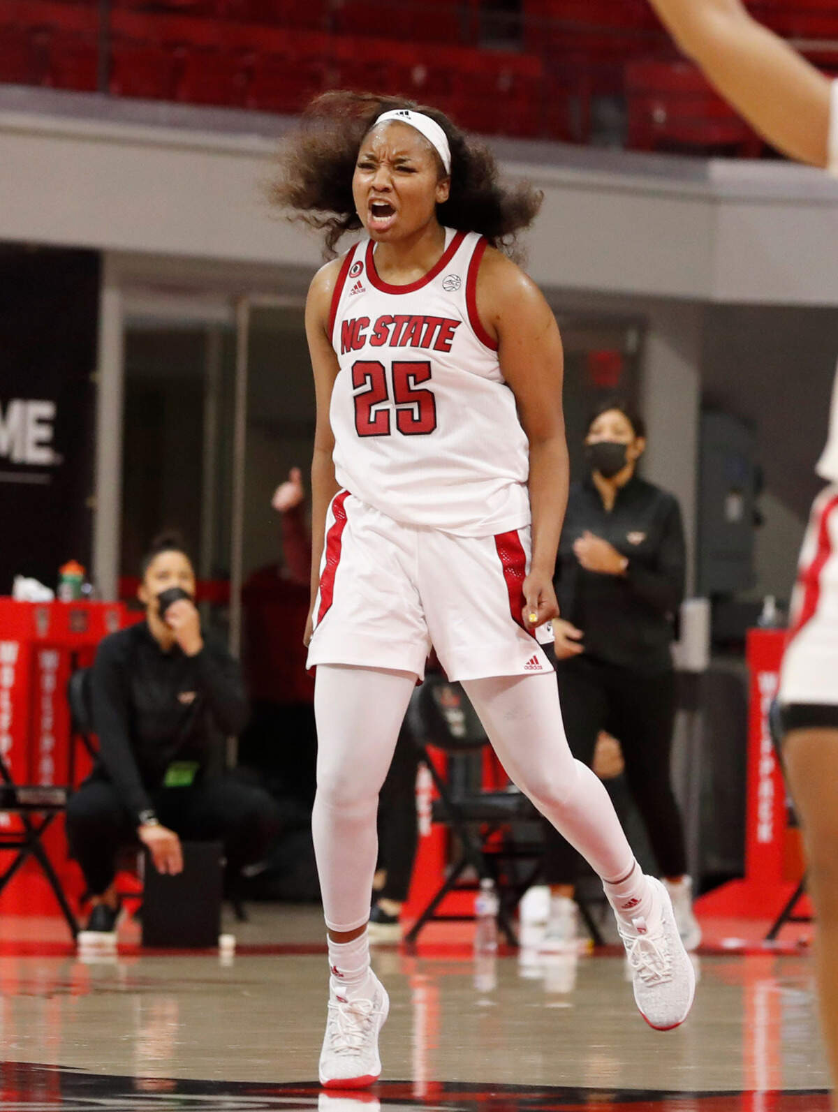 N.C. State’s Kayla Jones (25) celebrates hitting a three-pointer late in the second half of N.C. State’s 89-87 victory over Virginia Tech at Reynolds Coliseum in Raleigh, N.C., Sunday, January 24, 2021.