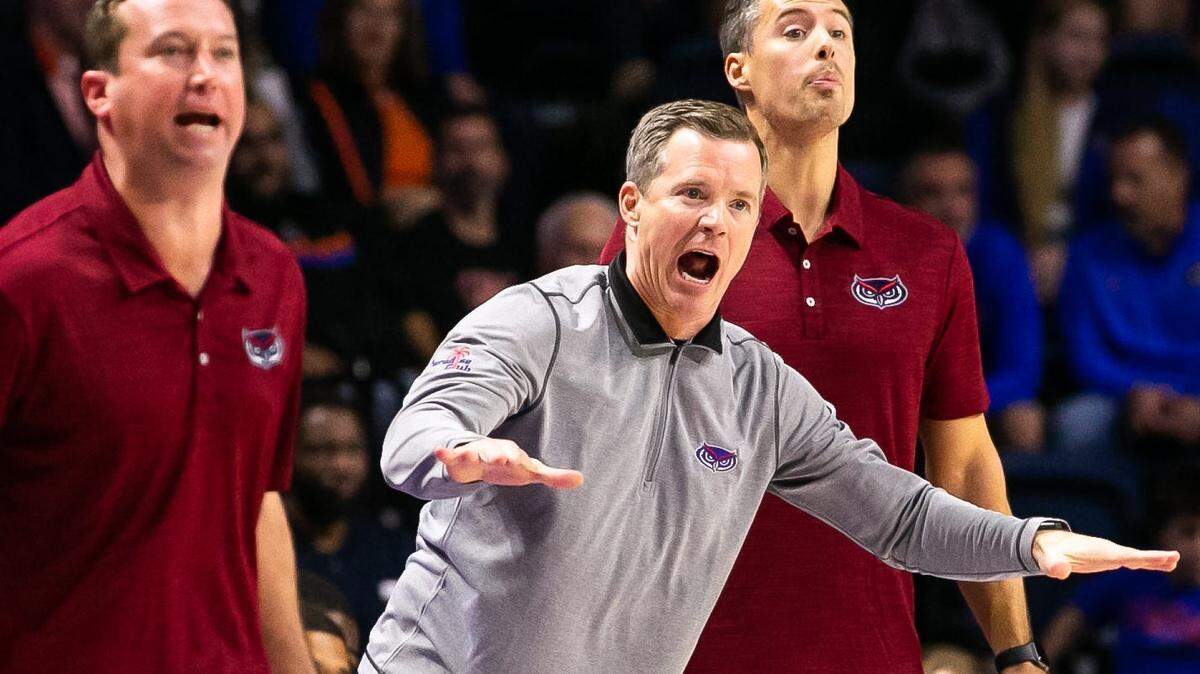 Florida Atlantic men’s basketball coach Dusty May, center, yells during the Owls’ November win at Florida. May has FAU one win away from playing for a national championship.