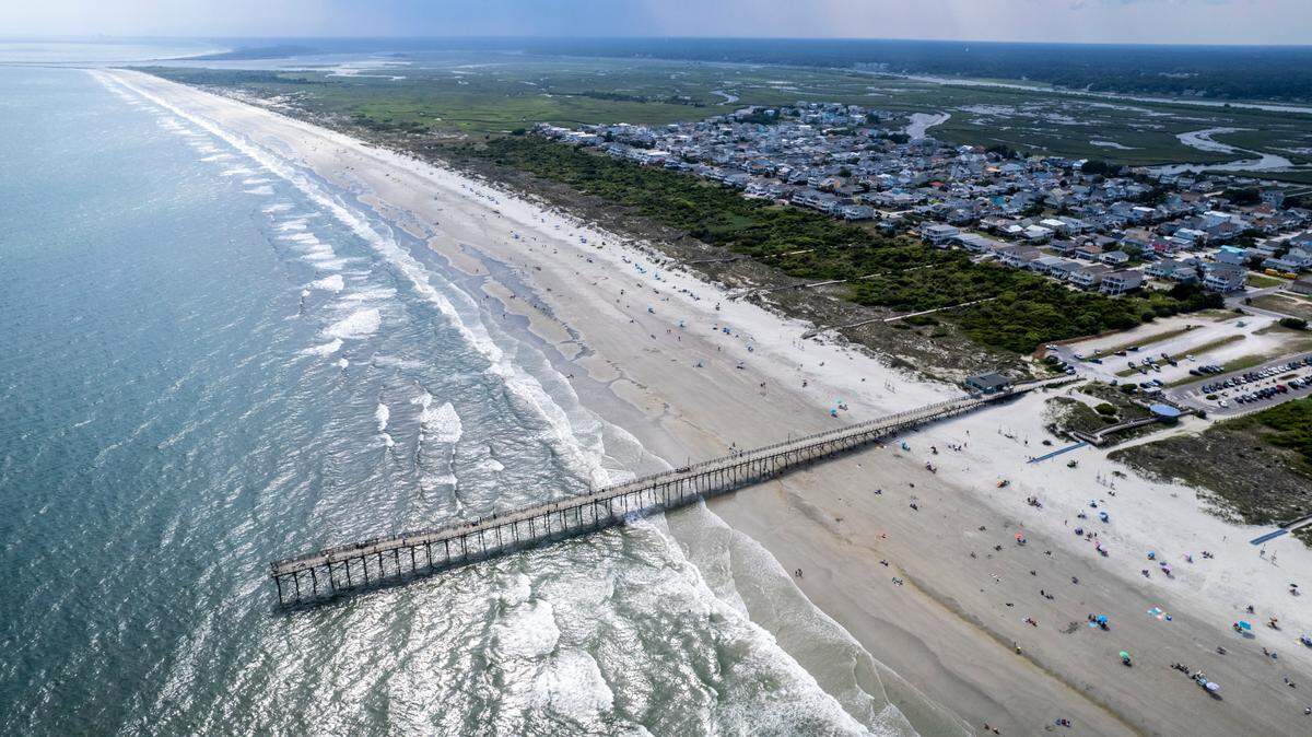 Sunset Beach Pier juts out into the Atlantic Ocean. North Carolina’s coast is home to 19 fishing piers.