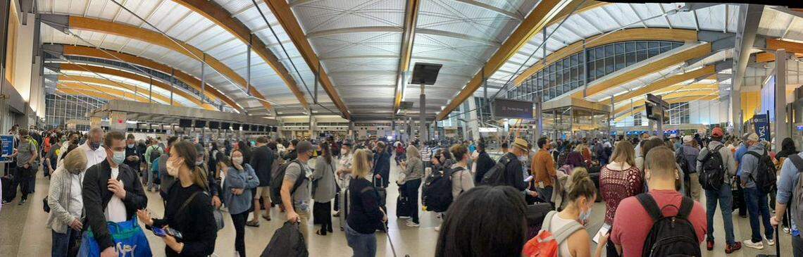 Passengers wait in long lines at security checkpoints at RDU Terminal 2, Friday morning, Nov. 12, 2021.
