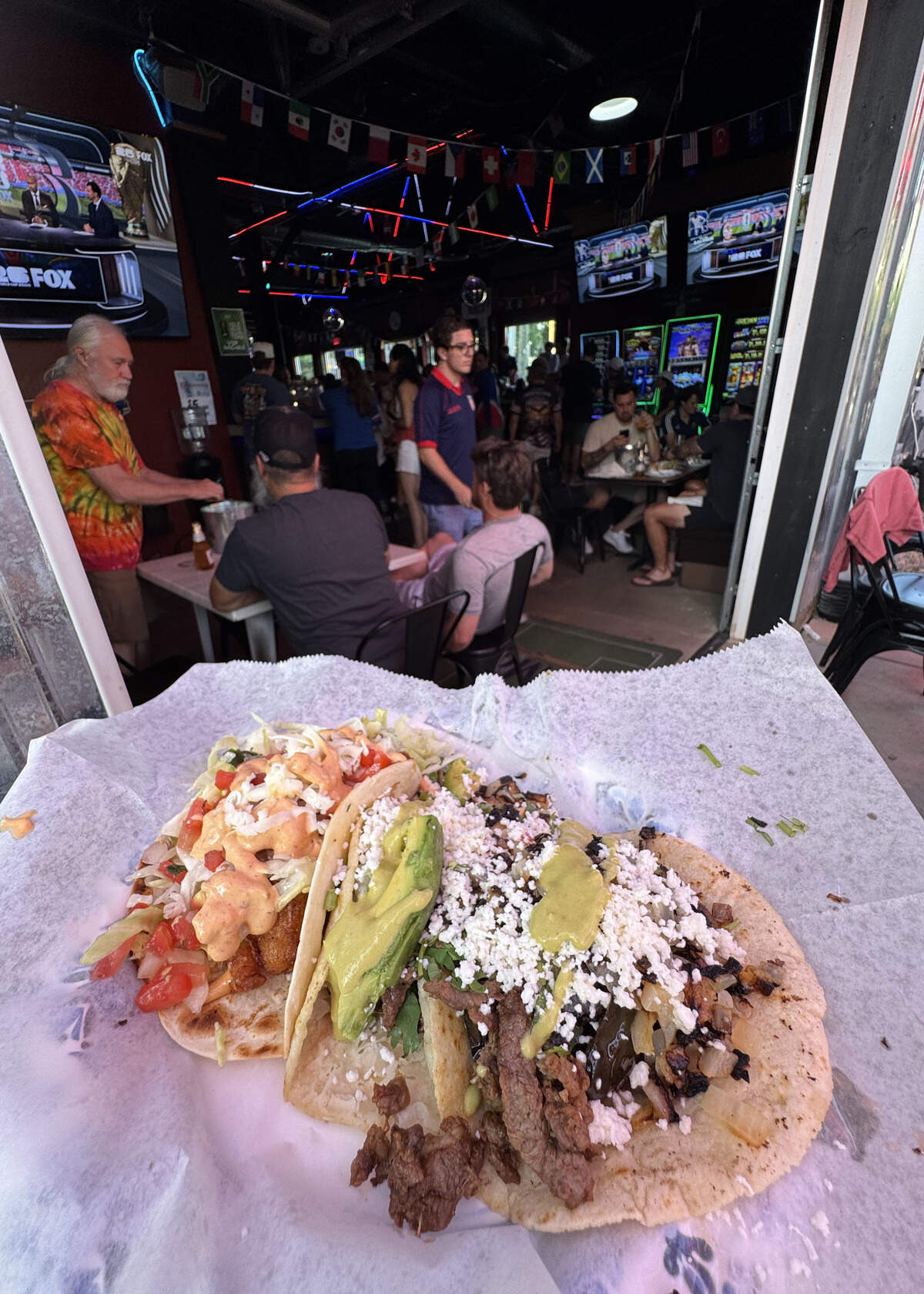 Three tacos from the Taco Addicts food truck cost $16.67, including tax and tip, during the U.S. men’s national team watch party at Olé.