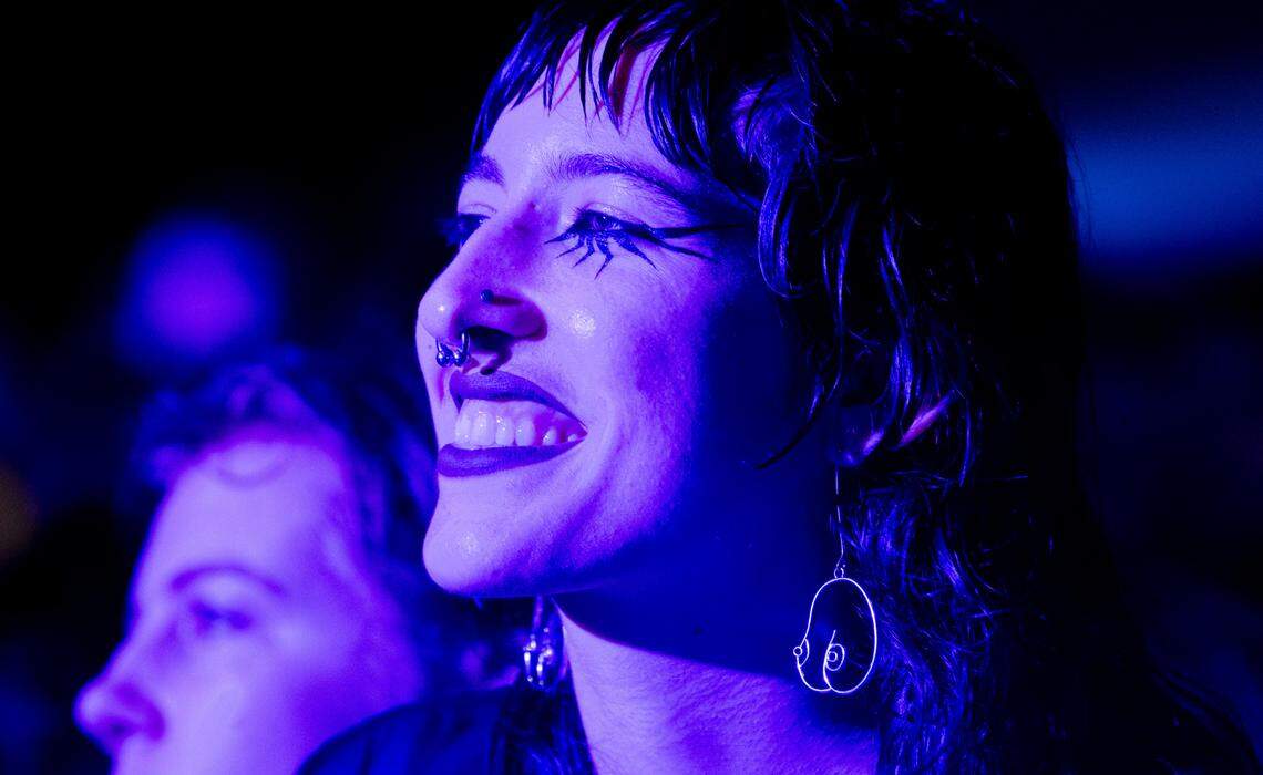 A happy fan watches as Soccer Mommy plays at the Hopscotch Music Festival in Raleigh, N.C., Saturday night, Sept. 9, 2023.