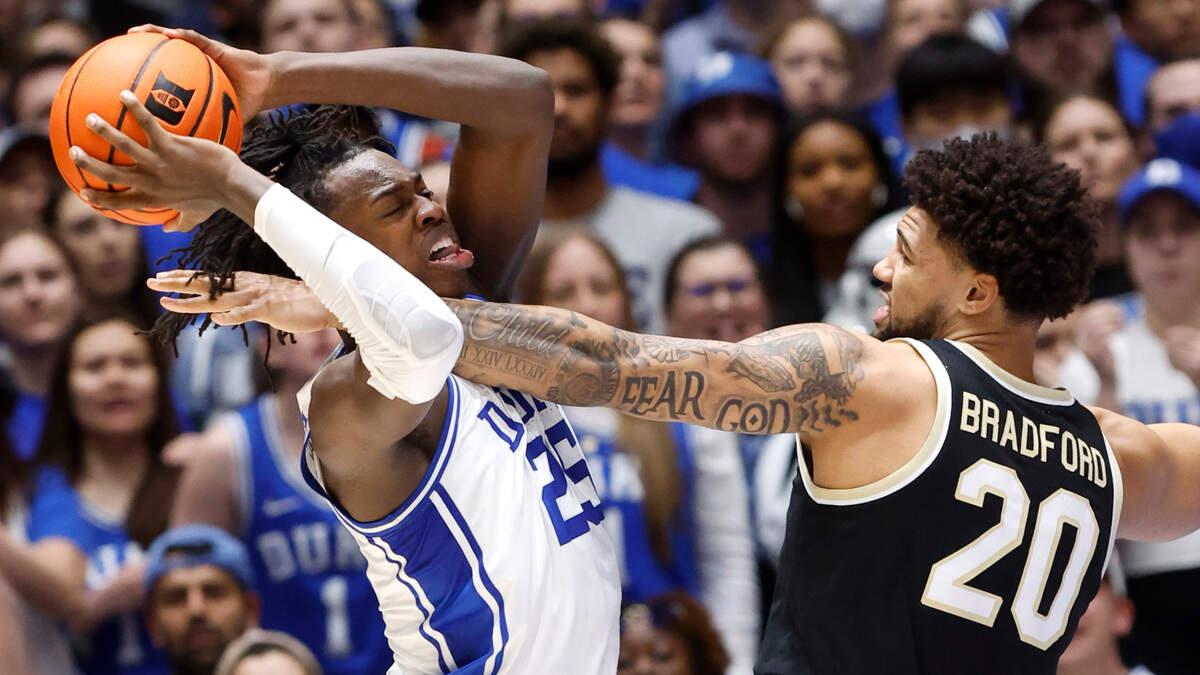 Duke’s Mark Mitchell (25) pulls in the rebound from Wake Forest’s Davion Bradford (20) during the first half of Duke’s game against Wake Forest at Cameron Indoor Stadium in Durham, N.C., Tuesday, Jan. 31, 2023.
