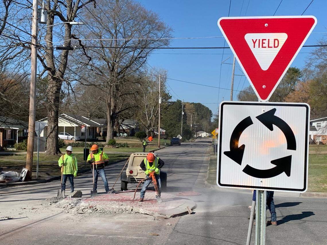 Contractors for the city remove a roundabout that was installed about a month ago at Weston Street and Little John Road in Southeast Raleigh. The city learned that GoRaleigh buses could not navigate around the roundabout without hitting a utility pole, seen here on the left side of the photo. A smaller roundabout will be installed in its place.