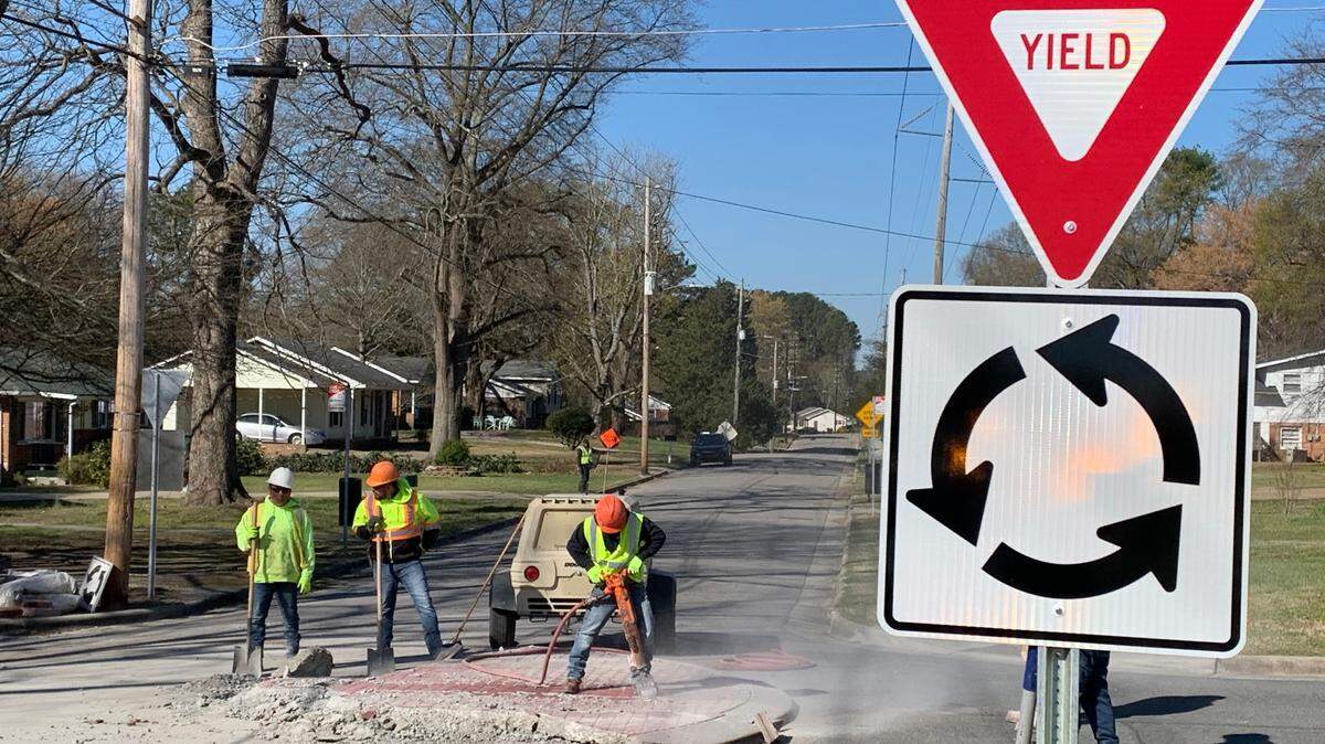 Contractors for the city remove a roundabout that was installed about a month ago at Weston Street and Little John Road in Southeast Raleigh. The city learned that GoRaleigh buses could not navigate around the roundabout without hitting a utility pole, seen here on the left side of the photo. A smaller roundabout will be installed in its place.