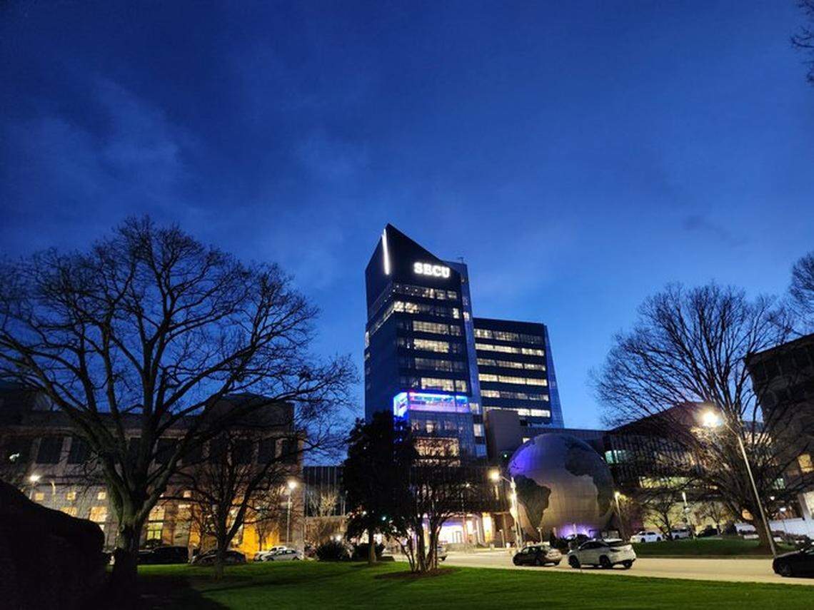 The N.C. Museum of Natural Sciences, pictured here in March 2023 from the lawn of the N.C. Legislative Building , is known for its giant globe on Jones Street. It is also known as the museum with the Dueling Dinosaurs exhibit, with an entrance next to the globe.