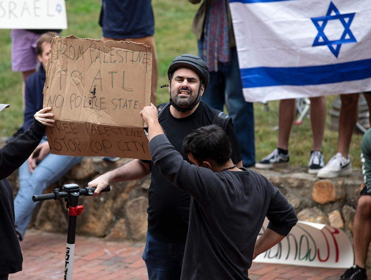 Pro-Palestinian demonstrators and counter-protesters interact during a rally in support of Palestinians at UNC-Chapel Hill on Thursday, Oct. 12, 2023. The rally was organized by the UNC chapter of Students for Justice in Palestine.