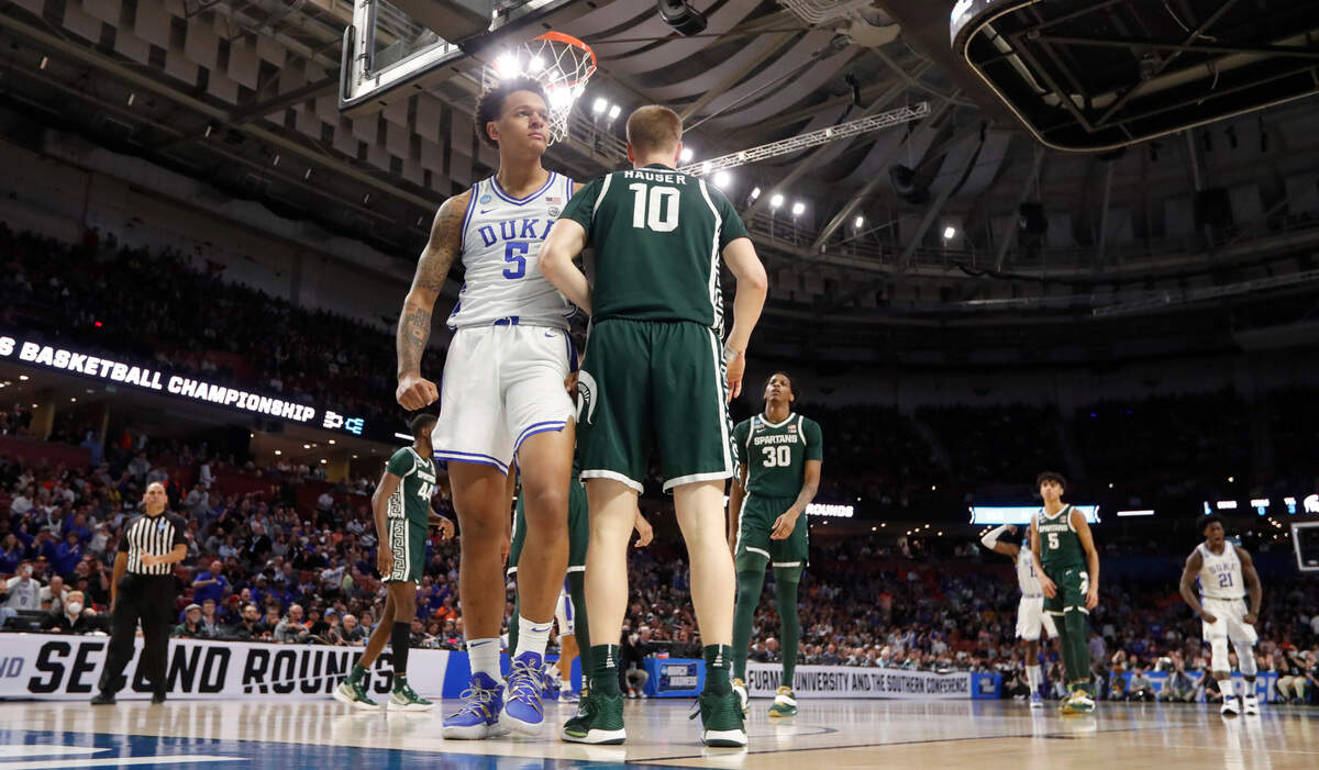 Duke’s Paolo Banchero (5) reacts after making the basket while being fouled during Duke’s 85-76 victory over Michigan State in the second round of the NCAA Tournament at Bon Secours Wellness Arena in Greenville, S.C., Sunday, March 20, 2022. Michigan State’s Joey Hauser (10) is to the right.