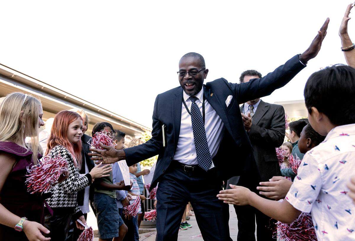 New Wake County Superintendent Robert Taylor greets students and faculty at Rolesville Elementary School on his first day on the job on Monday, Oct. 2, 2023, in Rolesville, N.C.