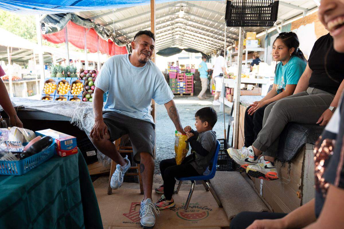 Juan Garcia enjoys quality time with his family at the Buckhorn Flea Market on Saturday, June 15, 2024. The family has spent Saturday’s at the market for years and will even sleep at their stand to ensure they have a prime location to sell at.
