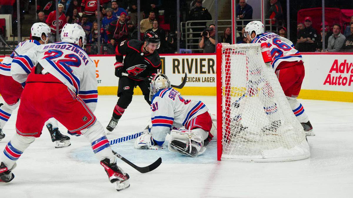 Mar 12, 2024; Raleigh, North Carolina, USA; New York Rangers goaltender Igor Shesterkin (31) stops the shot in close by Carolina Hurricanes left wing Jake Guentzel (59) during the third period at PNC Arena. Mandatory Credit: James Guillory-USA TODAY Sports