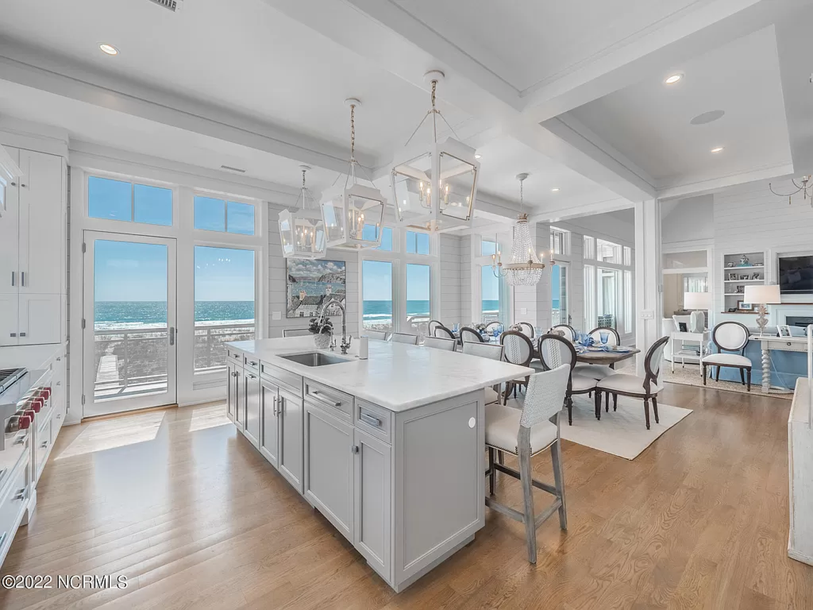 UNC football coach Mack Brown’s coastal home spans 5,579 square feet and sits on a 0.55-acre lot overlooking the Atlantic Ocean.