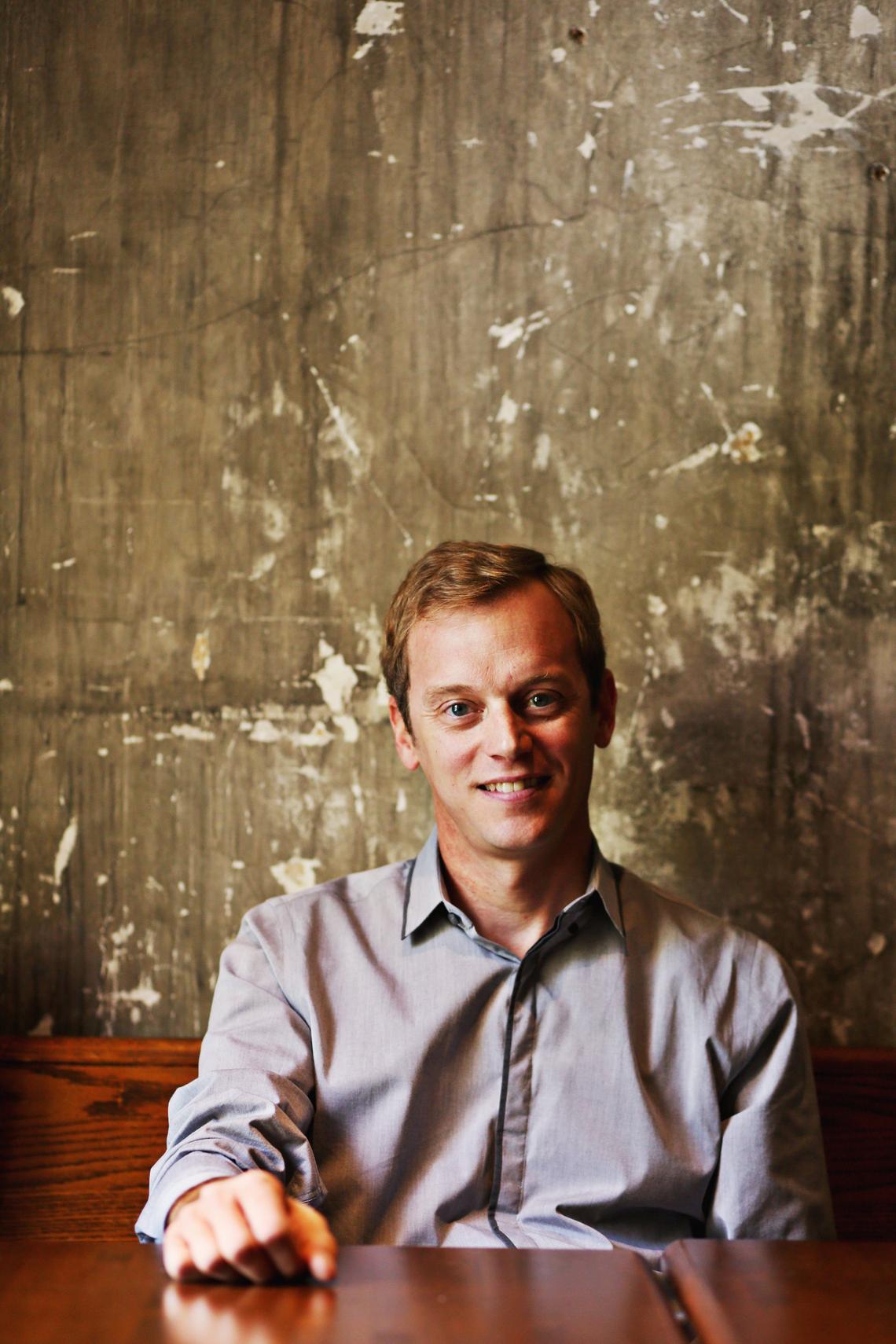 Hank Smith sits in the upstairs bar at the Raleigh Times in downtown Raleigh, Sept. 6, 2018. Smith considers the Raleigh Times his favorite “unconventional venue” where he regularly plays “Beer & Banjos” on Tuesday nights.