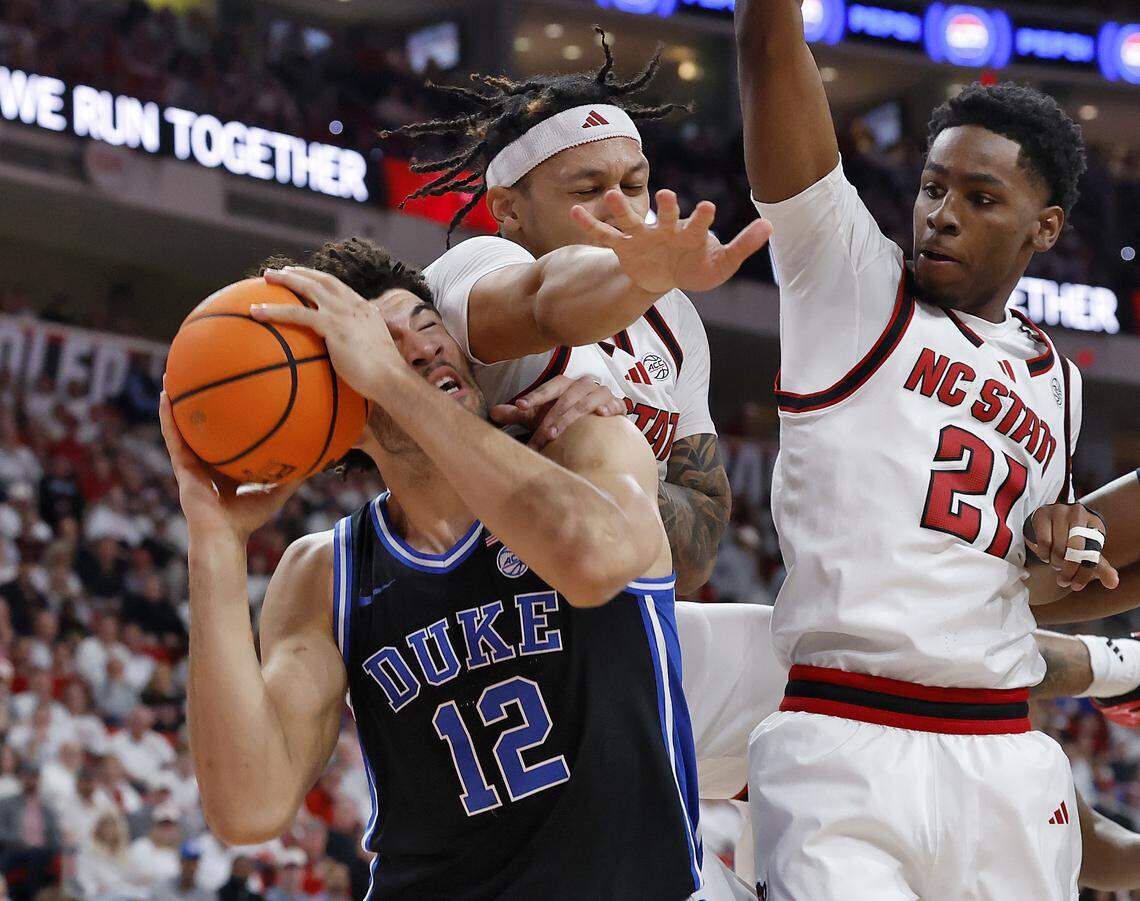 Duke’s Cameron Boozer is fouled as he posts up against N.C. State’s Darrion Williams and Terrance Arceneaux during the first half of the Blue Devils’ 93-64 win on Monday, March 2, 2026, at Lenovo Center in Raleigh, N.C. 