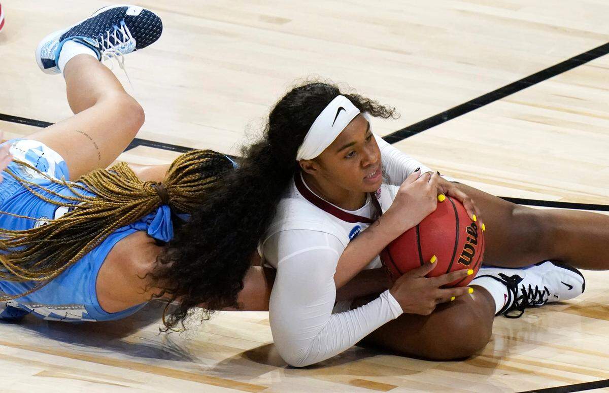 Alabama guard Jordan Lewis fights for a loose ball with North Carolina guard Stephanie Watts, left, during the second half of a college basketball game in the first round of the women’s NCAA tournament at the Alamodome in San Antonio, Monday, March 22, 2021. (AP Photo/Eric Gay)