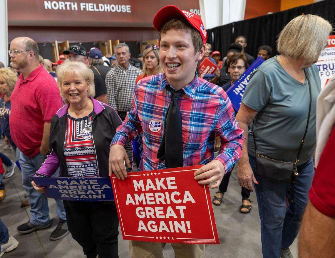 Damien Cadena of Nashville, N.C. and his grandmother Donna Bragg leave the Rocky Mount Event Center after attending a rally for Republican presidential nominee, former President Donald Trump on October 30, 2024 in Rocky Mount, N.C.